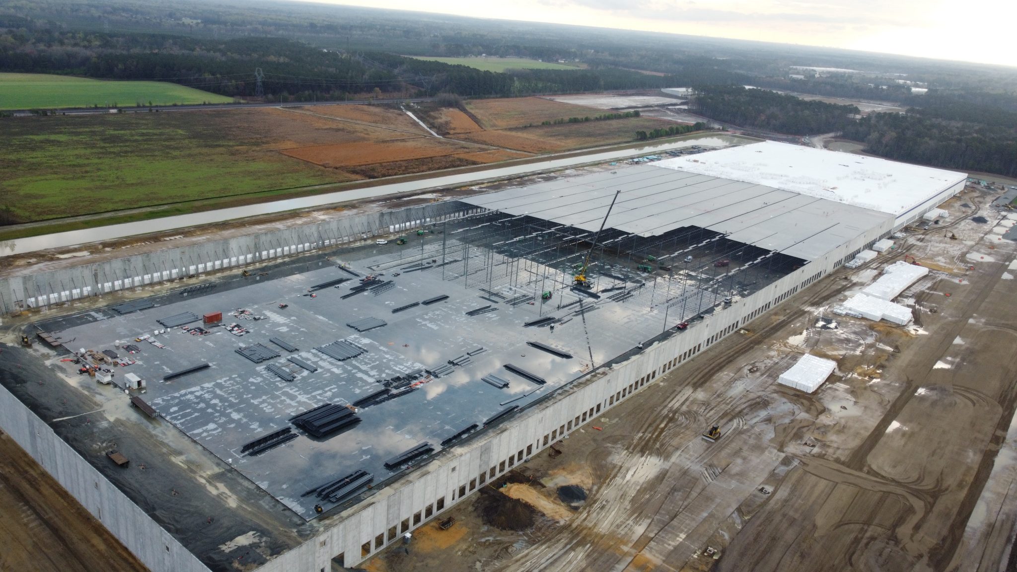 Aerial view of a large-scale commercial construction project under QA/QC oversight